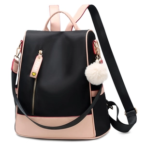 Waterproof Oxford fabric backpack for women in black and pink with pompom charm