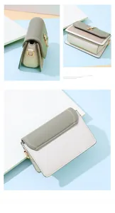Detail view of sage green and off-white crossbody bag with stitching and gold lock