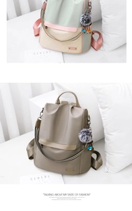 Detailansicht des Diebstahlschutz-Rucksacks mit Boho-Gurt und Plüschkugel-Anhänger