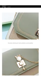 Close-up of contrast leather texture with cat-shaped gold lock and fine chain detail
