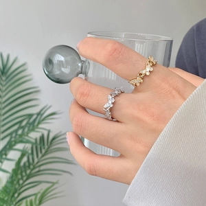 Exquisite gold and silver butterfly rings with micro-set zircons on an elegant open band