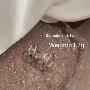 Detailed view of silver H-shape earrings with zircon inlay, size 1.3cm and 1.7g weight