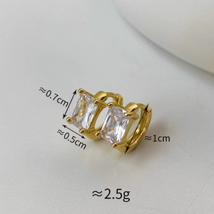 Macro detail of gold hoop earring with dimensions showing rectangular cubic zirconia