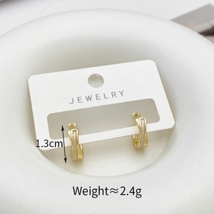 Detail view of gold hoop earrings with shell inlay, measuring 1.3cm and 2.4g weight
