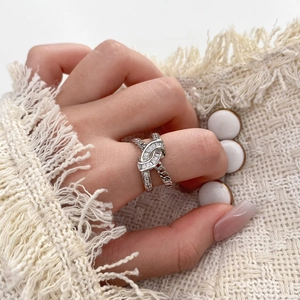 Silver knot link ring with cubic zirconia micro-pave and emerald-cut center stone