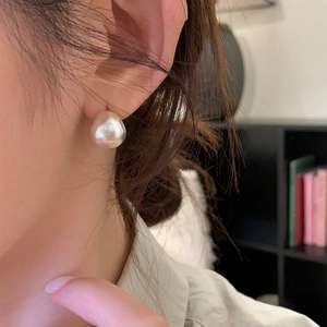 Baroque irregular pearl stud earrings in gold plated brass with natural glossy white finish