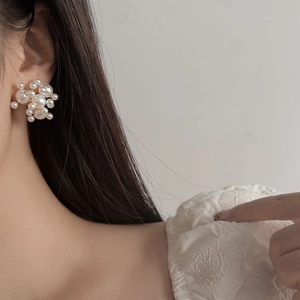 Elegant gold-plated cluster stud earrings featuring mixed sizes of high-luster white pearls