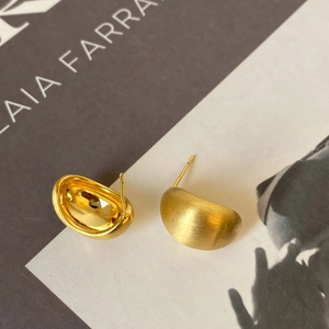 Gold-plated curved bean earrings with brushed matte finish and polished interior details
