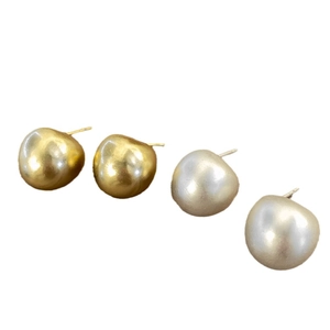 Minimalist bean-shaped metal stud earrings in gold and silver matte finish