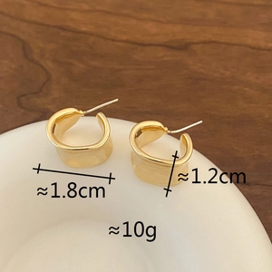 Detail view of 18k gold plated geometric C-shape earrings with precise size dimensions