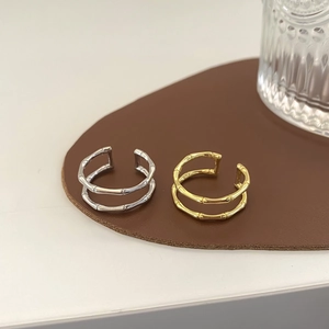 Minimalist double-layer bamboo joint rings in polished gold and silver finish