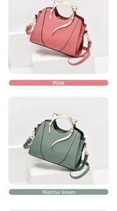 Detailed view of pink and green handbags featuring unique golden cat-ear metal handles