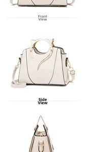 Detail of cream white handbag featuring cat-ear shaped golden metal handles and hardware