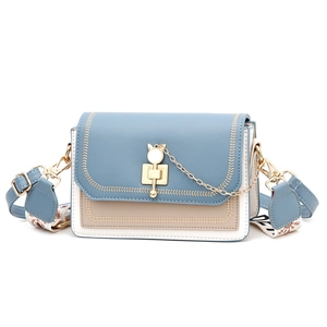Three-color patchwork square crossbody bag with golden cat buckle and wide pattern strap