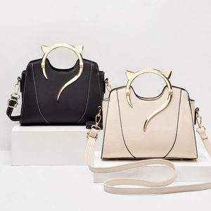 Fashionable women's crossbody handbags with cat ear golden metal handles in black and beige