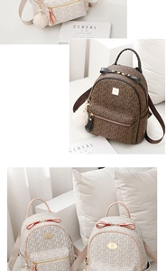 Detail view of mini PU leather backpacks with letter prints and plush ball pendants