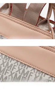 Close-up of reinforced wide nylon straps and premium stitching on the pink backpack