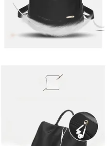 Détail d'un sac à dos léger en nylon noir montrant le port casque et le logo métallique