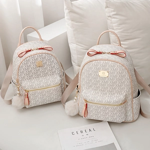 Fashionable cream white leather backpacks with MFX monogram and red bow handles