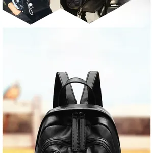 Detail of black faux leather backpack featuring dual zippers and cute panda charm accessory