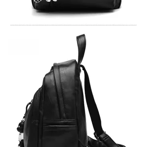 Side view of black faux leather backpack with lychee texture and panda charm detail