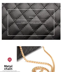 Detail of black quilted leather texture and gold metal chain strap on crossbody bag