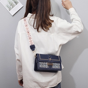 Navy blue checkered crossbody bag with embroidered wide strap and woven tweed flap design
