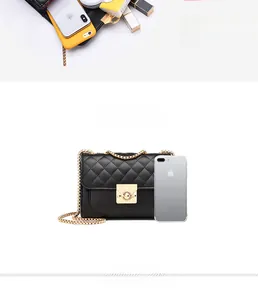 Detail view of black quilted crossbody bag with gold chain and interior capacity display