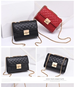 Detail of quilted crossbody bags with chain straps and gold twist locks in black and red