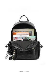 Internal view of black crocodile pattern backpack showing its large storage capacity