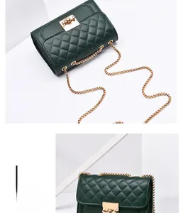 Detail of dark green quilted shoulder bag with gold chain strap and metal clasp