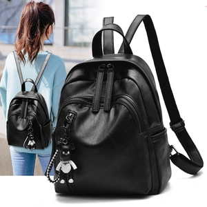 Fashionable black faux leather mini backpack with dual front zippers and bear charm