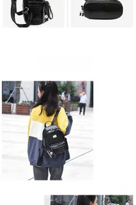 Close-up of black crocodile pattern backpack with checkerboard ribbon and bear pendant