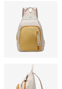 Detail of oxford cloth backpack with yellow zip pocket and FIDM heart tag
