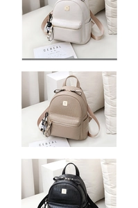 Detailed view of crocodile pattern leather backpacks in white, khaki and black with bow detail