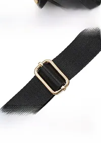 Detail of black adjustable shoulder strap with gold metal buckle for backpacks