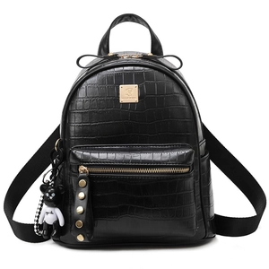 Chic black crocodile textured faux leather backpack with gold lion crest and bear charm