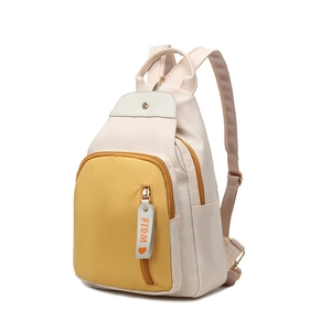 Minimalist oxford fabric backpack in cream and yellow with FIDM letter strap pendant