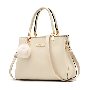 Elegant off-white PU leather tote bag with gold metal logo and white fur ball pendant