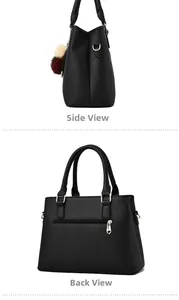 Detail view of the side and back of a black pebbled leather tote bag with gold hardware