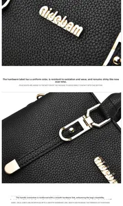 Detail of lychee pattern leather handbag with gold-tone hardware and reinforced stitching