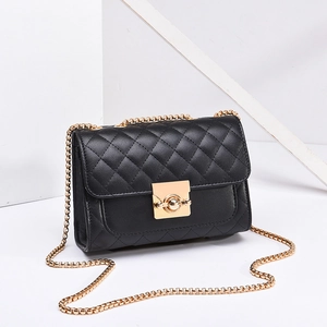 Classic black quilted crossbody bag with gold chain strap and metal turn-lock closure