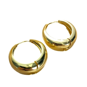 Minimalist chunky golden hoop earrings with a high-shine polished mirror finish