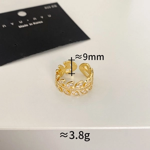 Macro shot of gold leaf ring with micro-set zircons showing 9mm width and 3.8g weight