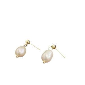 Elegant oval freshwater pearl stud earrings with 14k gold plated hardware on white background