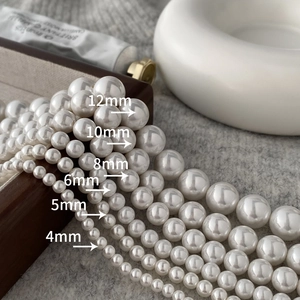 Size comparison of 4mm to 12mm round white shell pearl necklaces with glossy finish