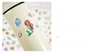 Waterproof holographic mermaid stickers with glitter vinyl finish on a matte water bottle