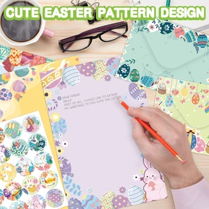 Cute Easter rabbit stationery set with envelopes and stickers on a wooden desk