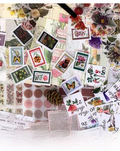 Detailed flat lay of 265pcs vintage botanical scrapbooking stickers and paper supplies