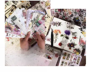 Detail of vintage floral scrapbooking stickers and botanical decorative paper kit